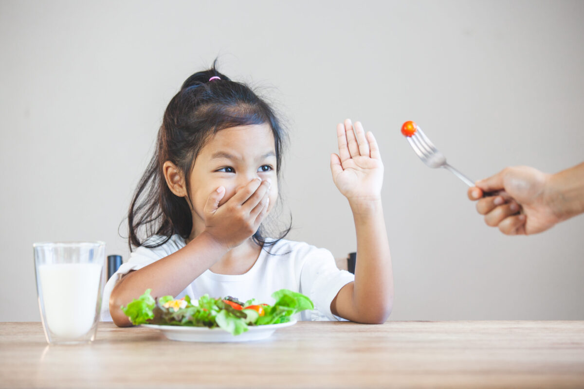Asian child does not like to eat vegetables and refuse to eat healthy vegetables